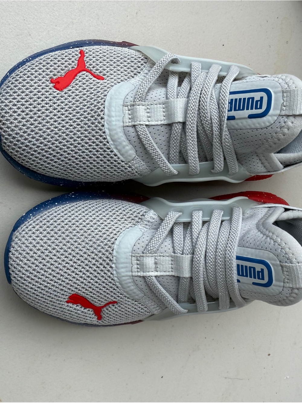 Puma Kids White Mesh Sneakers with Red and Blue Accents